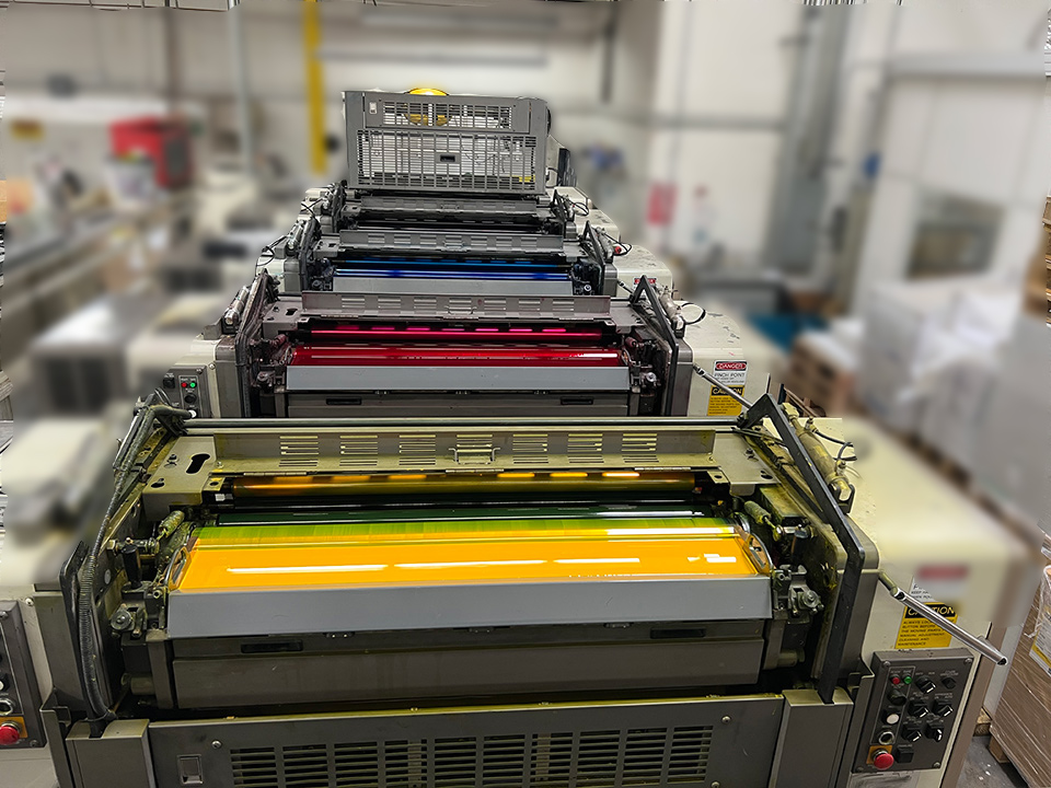 View from the top of full-color printing press showing ink bays and rollers