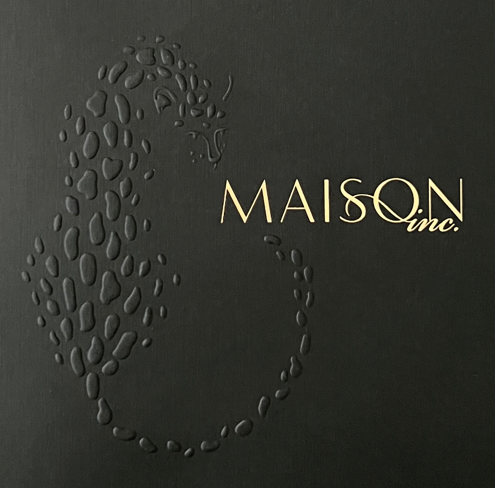 Photo showing detail of Maison's folder gold foil and embossing